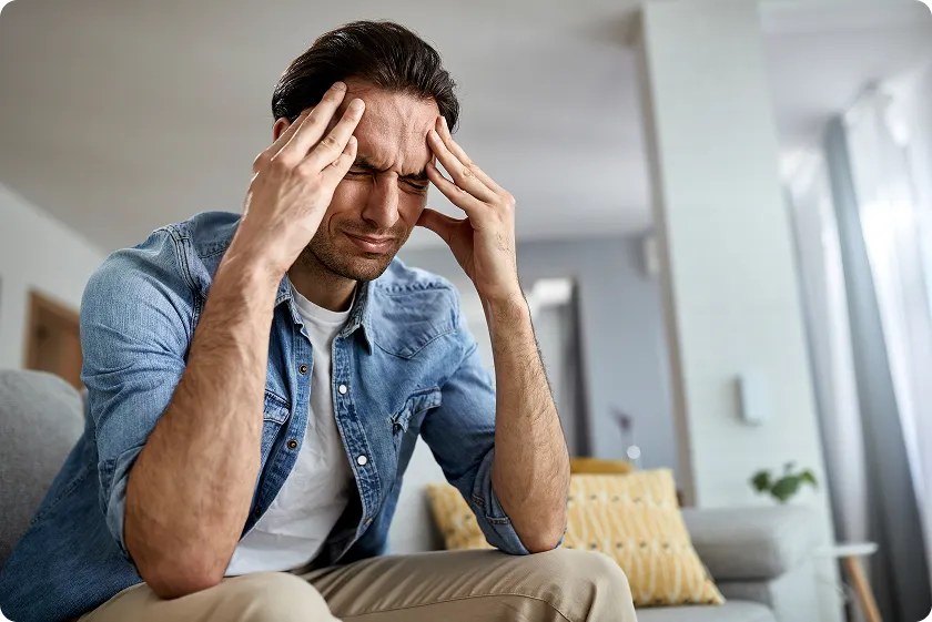 Man experiencing migraine headaches prevention tips for reducing pain