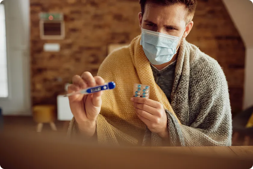 Woman holds medicine while learning how to prevent C diff