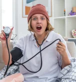 1 Doctor checking elderly patient’s pressure during Wegovy blood pressure monitoring visit