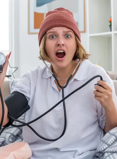 1 Doctor checking elderly patient’s pressure during Wegovy blood pressure monitoring visit