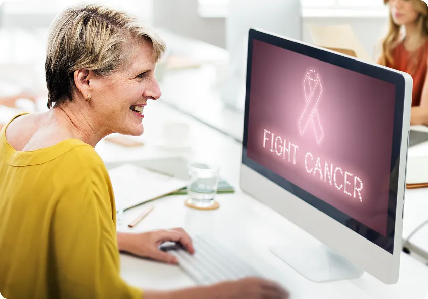 Older woman uses online resources to advocate for yourself during cancer care.