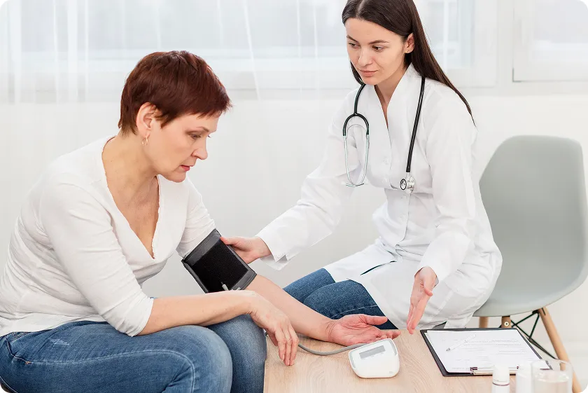 Person measuring blood pressure showing Wegovy low blood pressure side effect awareness