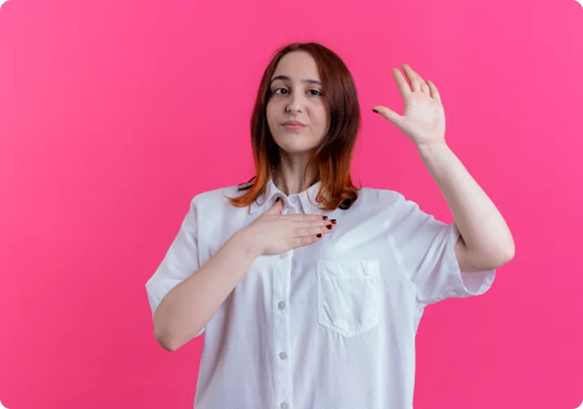 Woman highlights ESR1 mutation breast cancer awareness with pink ribbon.