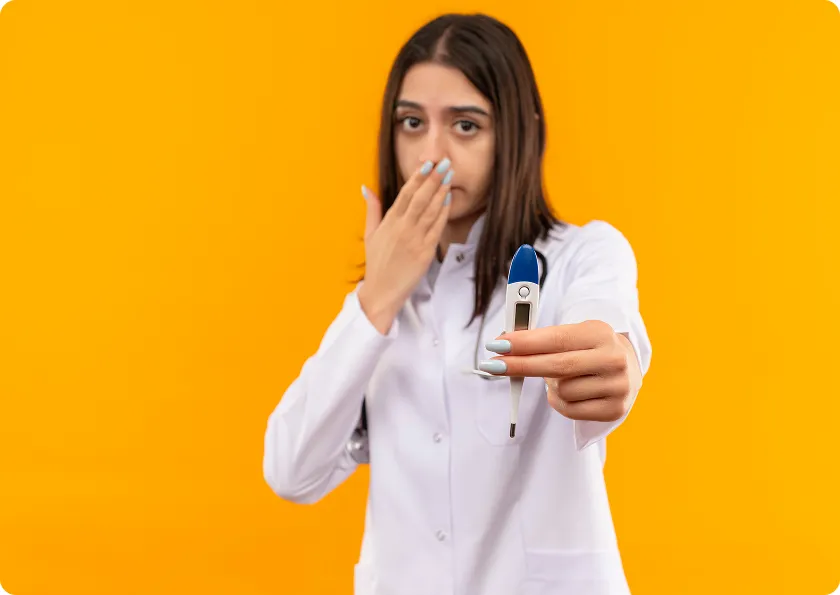Healthcare professional explaining Exdensur side effects and fever symptoms