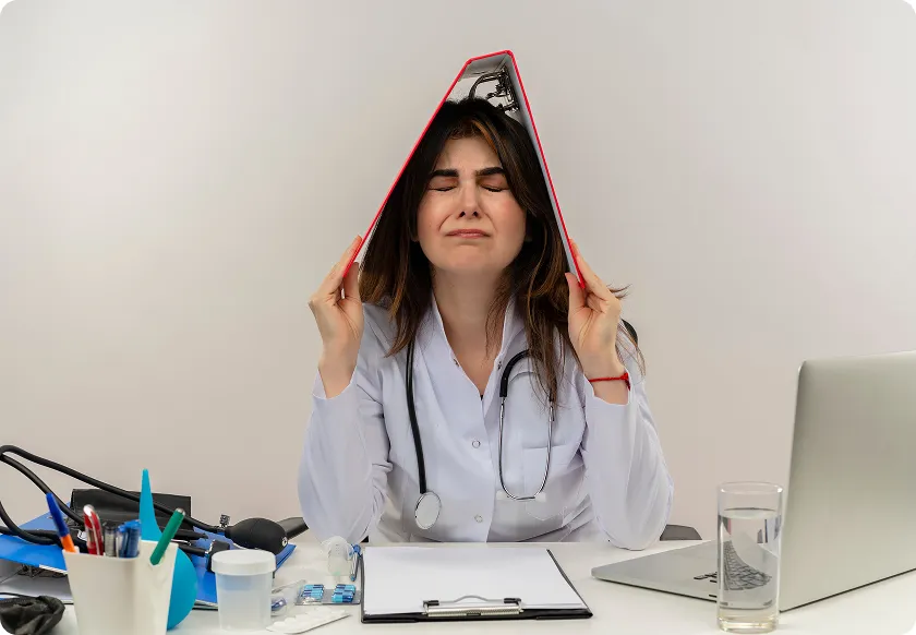 Clinician discusses CGRP inhibitors for migraine with distressed male patient.