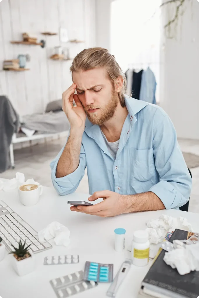 Overwhelmed doctor demonstrates stress linked to medication-overuse headache risks.