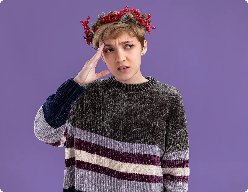 Woman practising a calming migraine self-care routine during head pain.
