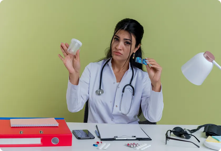 Doctor demonstrates handheld care device while explaining cystic fibrosis symptoms