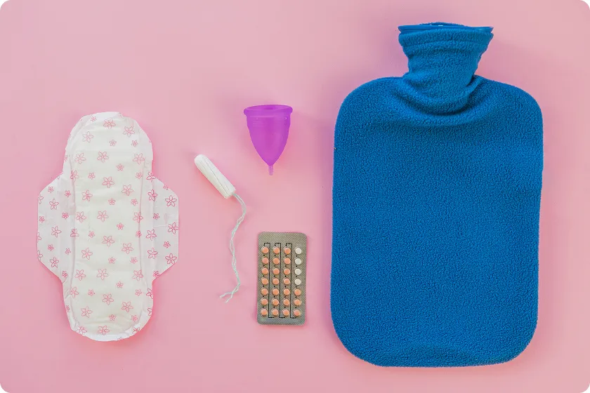 A blue hot water bottle used as a warm compress for constipation relief